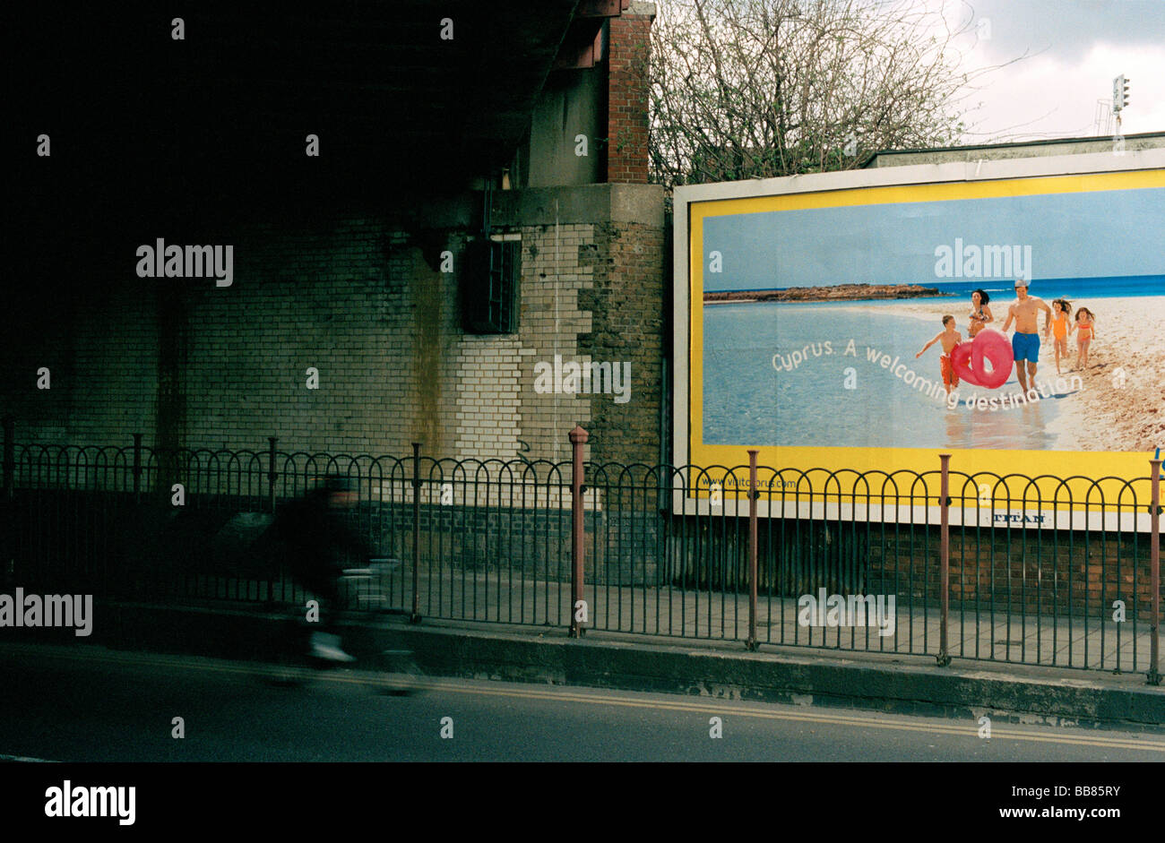 Billboard advertising a holiday destination in a grim south London
