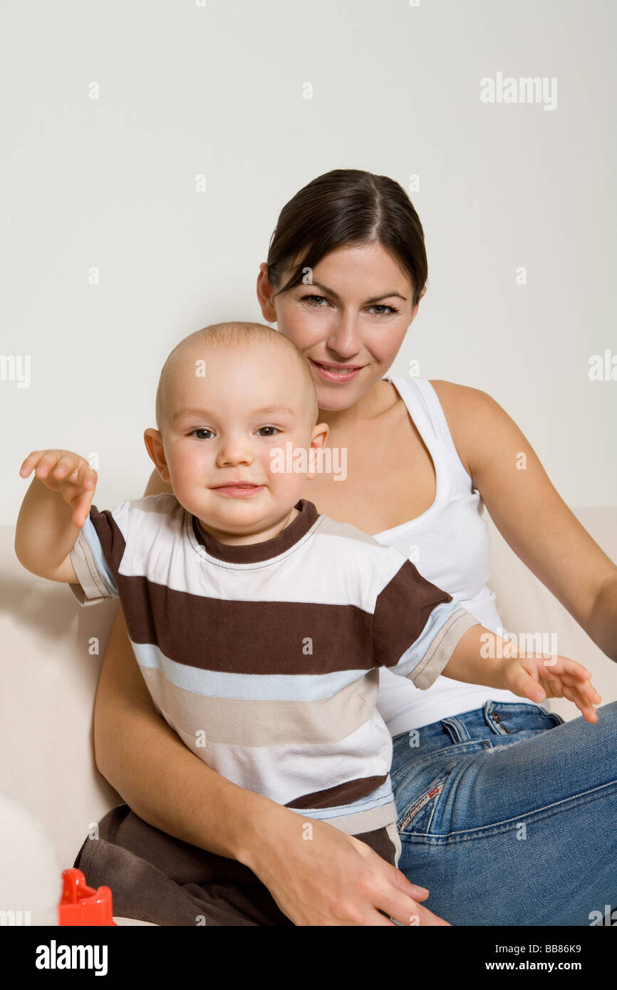 people, two, child, girl, boy, woman, mother, motherhood, son, douther, 0-5, 25-30, years, adult, brunette, interested, emotion Stock Photo