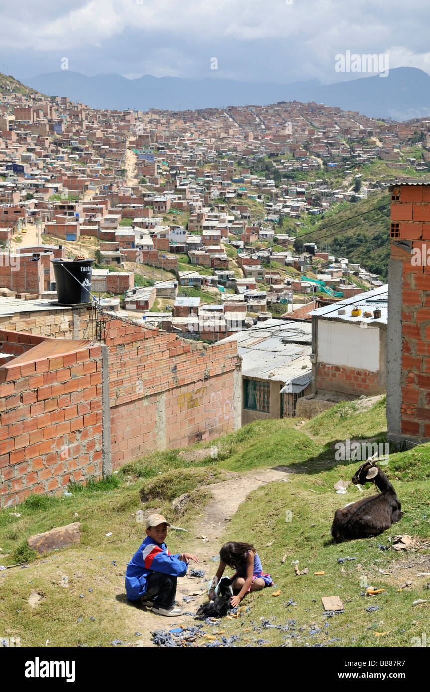 Children playing on a green area, slums of Alto de Cazuca, Soacha, Bogotá, Columbia Stock Photo
