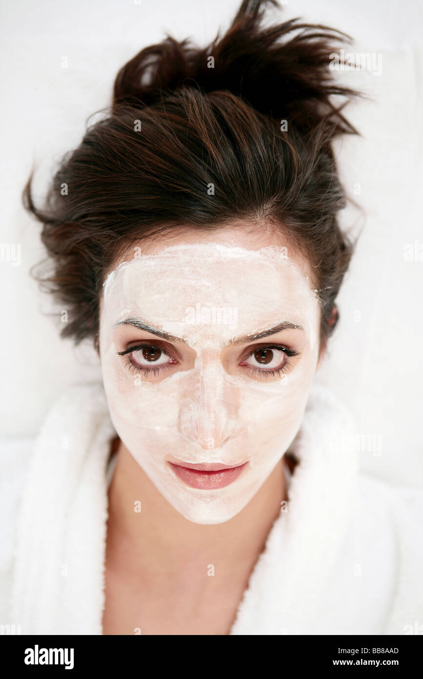 Portrait of young beauty woman's face with face mask Stock Photo