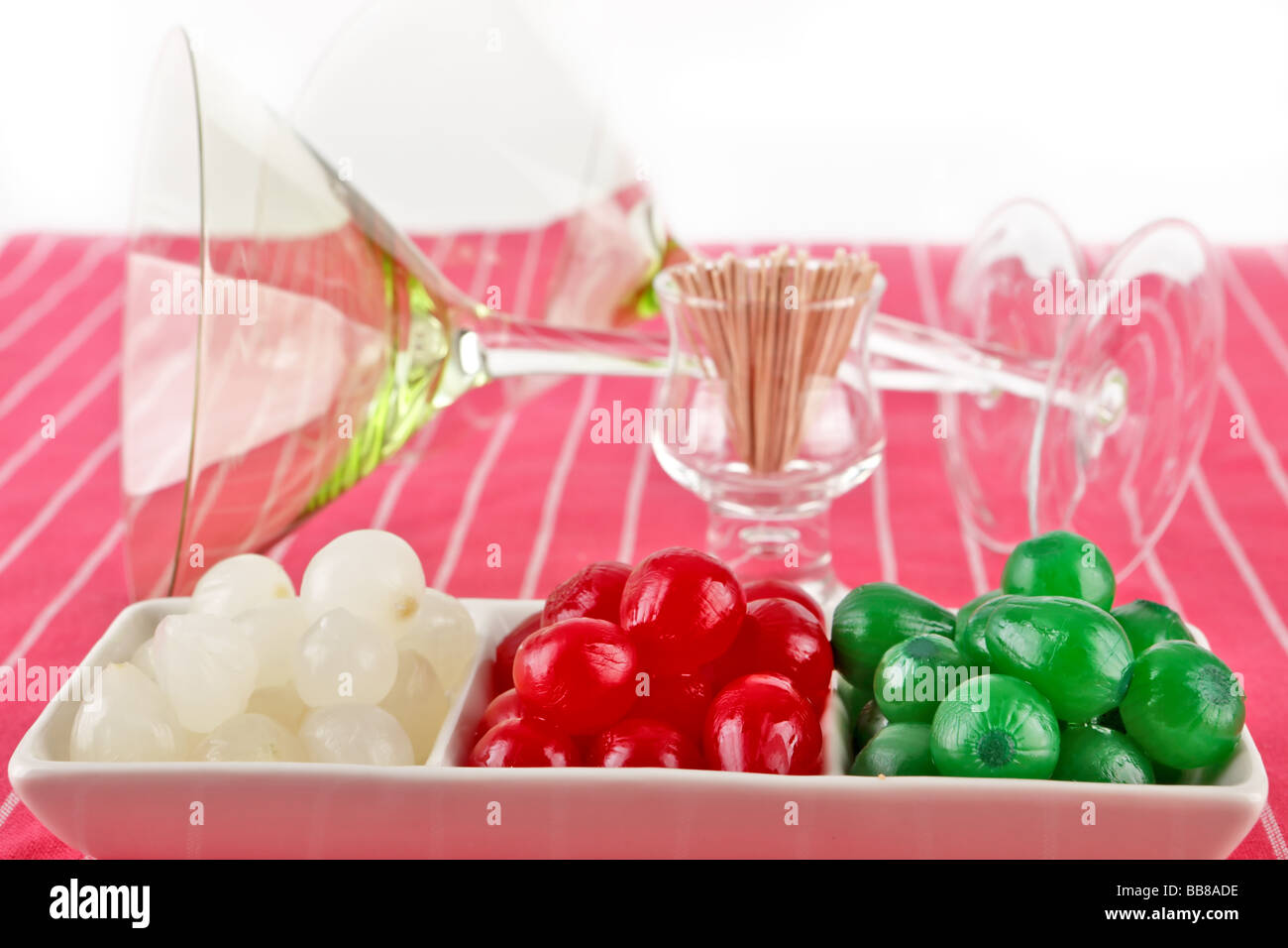 red green and white small cocktail onions on a plate ready for use Stock Photo