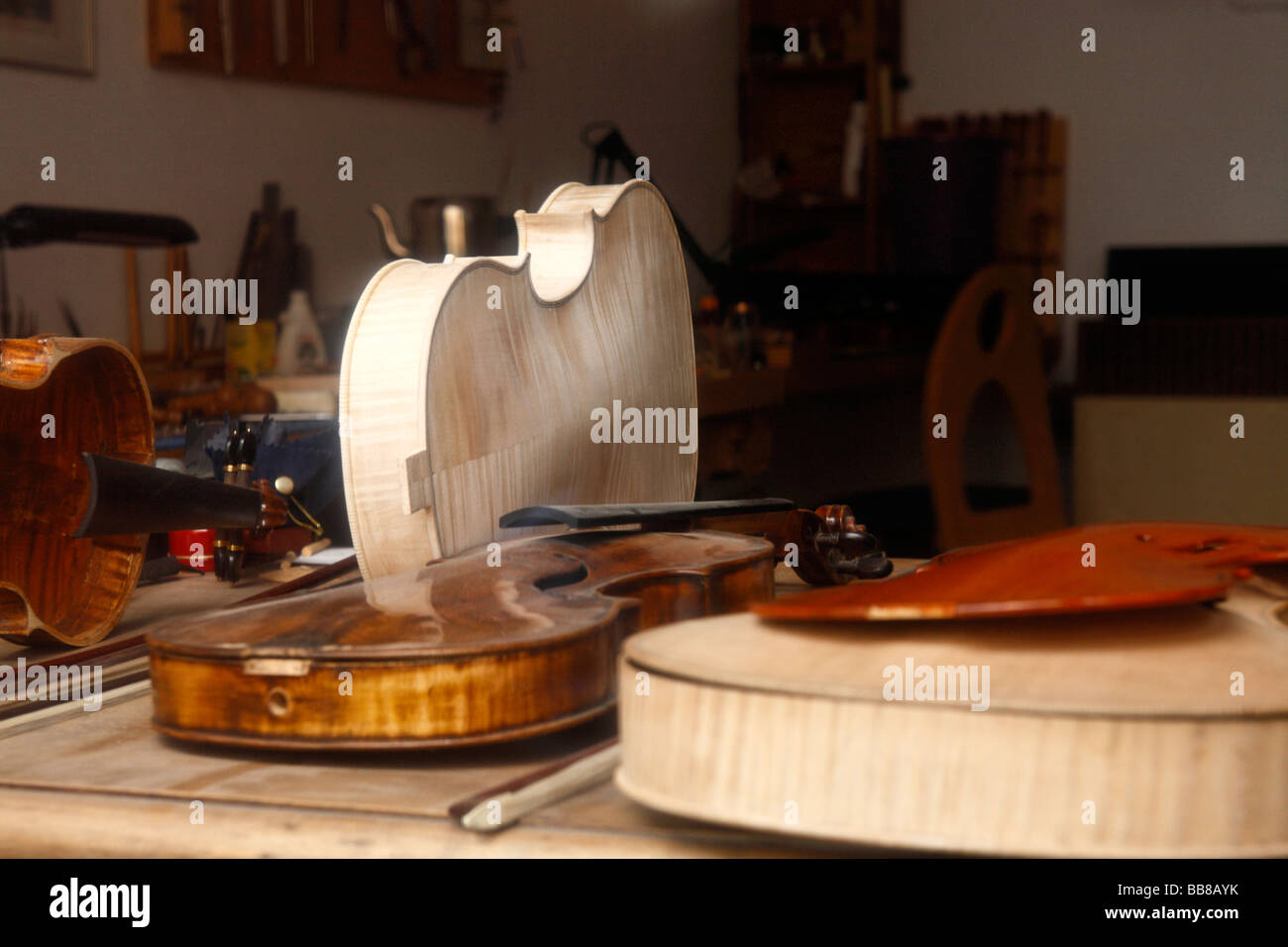 Unfinished New and Old Violins Stock Photo