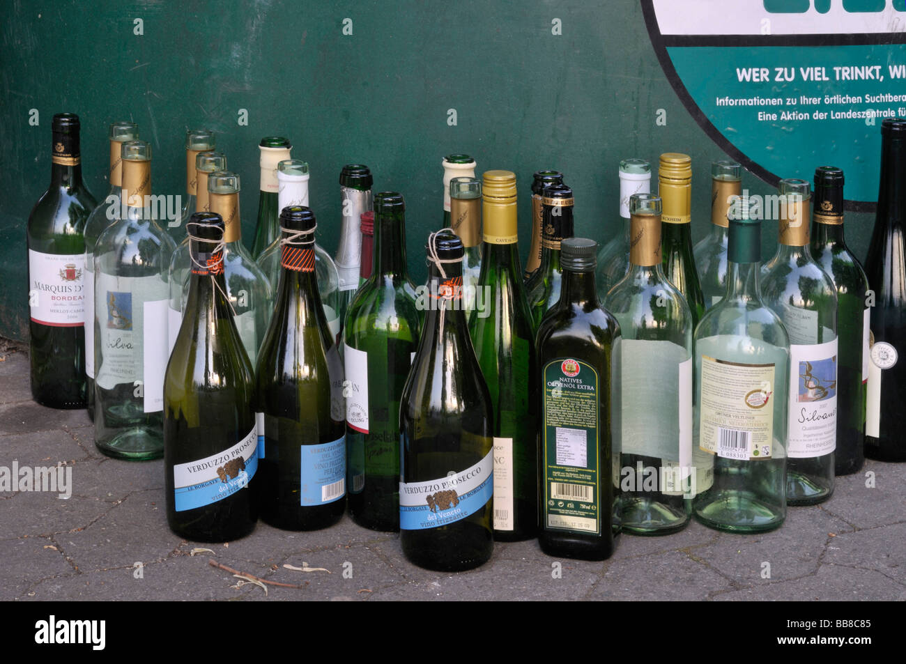 Bottles of alcohol in front of a glass bank Stock Photo