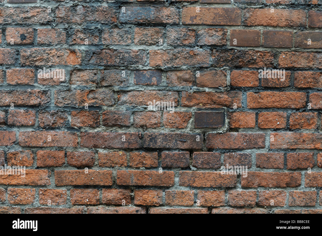 Old brick wall with water damage, background Stock Photo