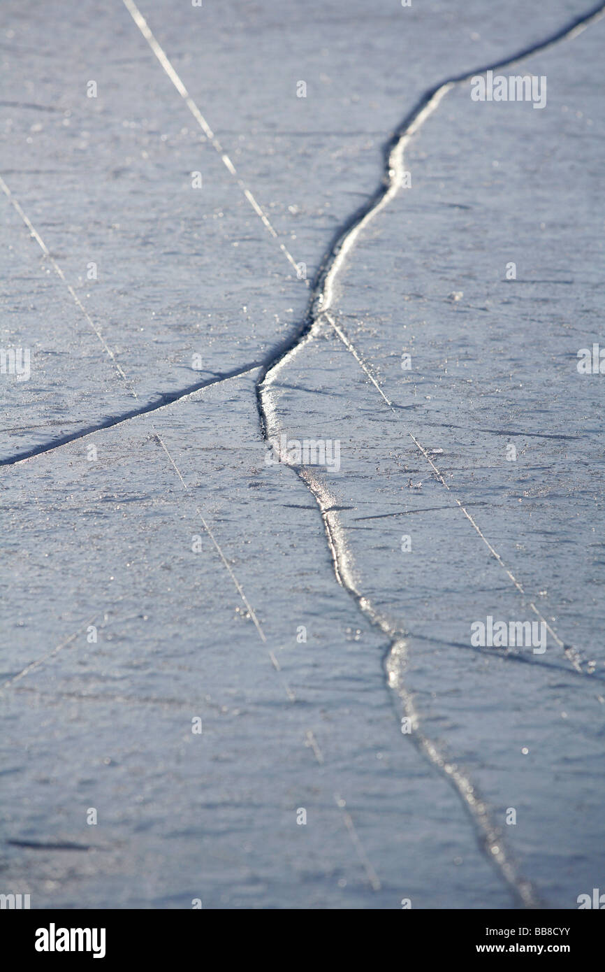 Fissures and traces in ice Stock Photo