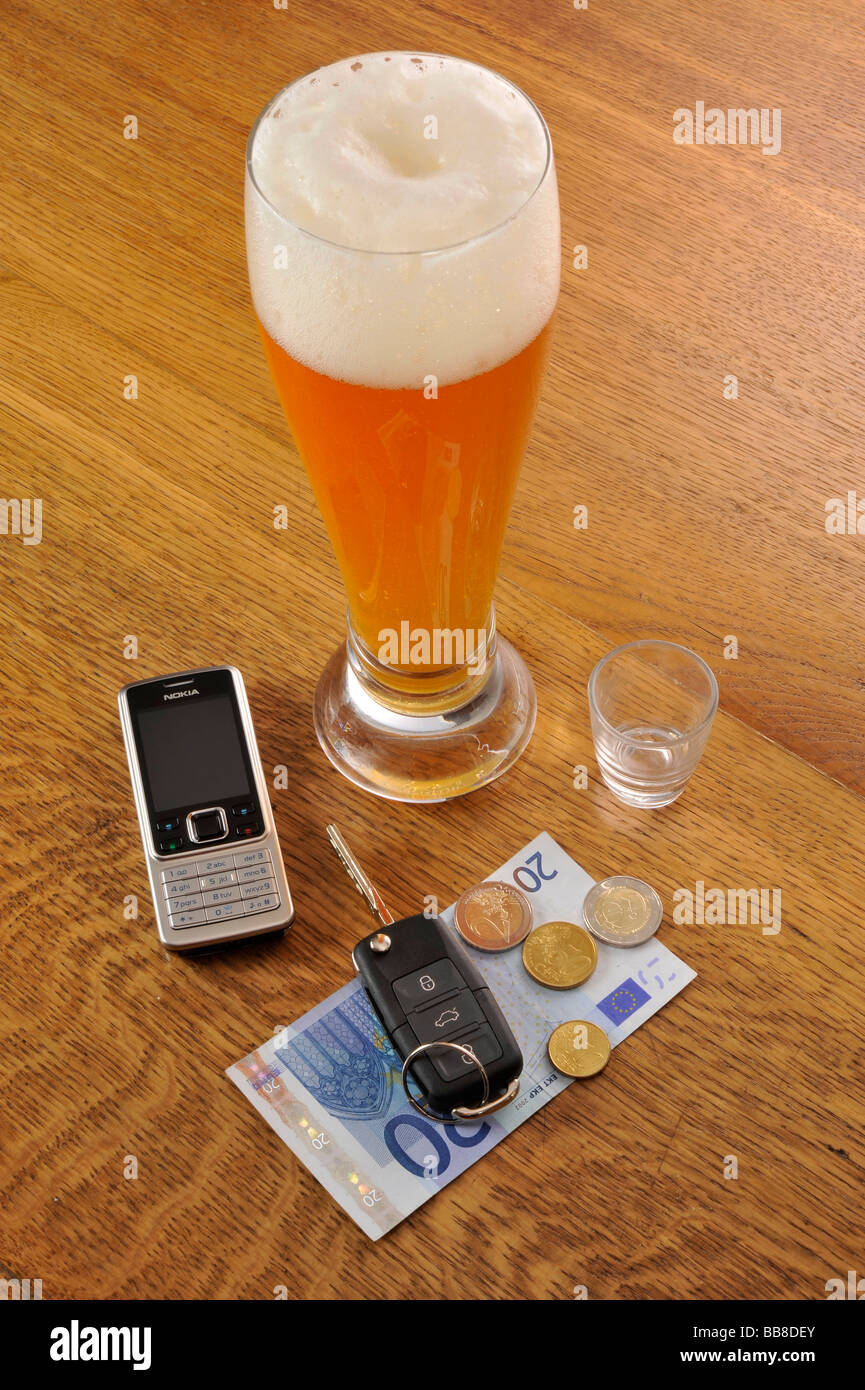 Wheat beer, car keys, symbolic of drink-driving Stock Photo