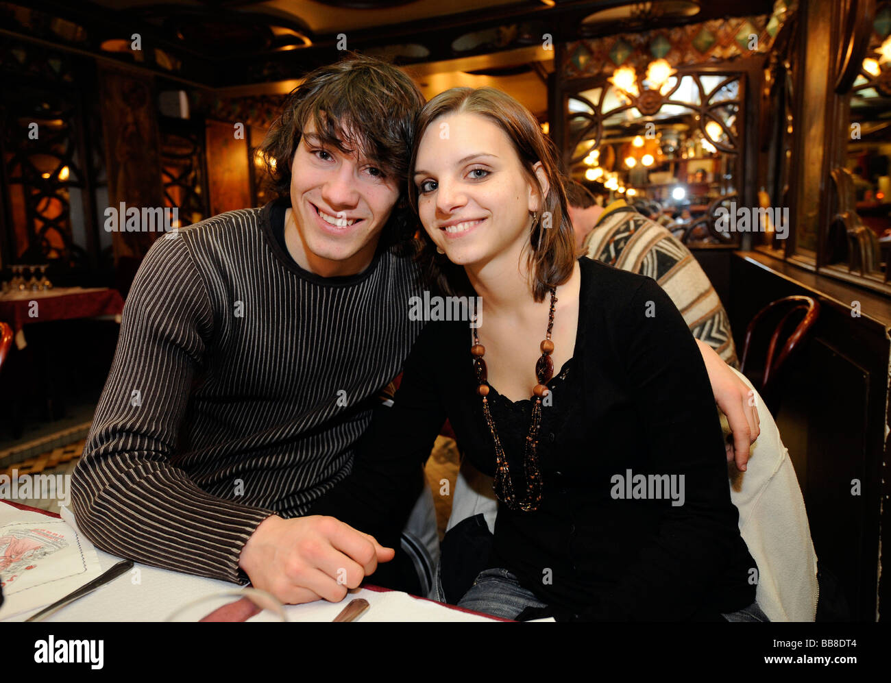 Young couple in love, in a restaurant, Paris, France, Europe Stock Photo