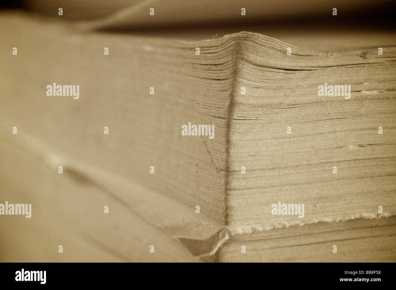 Corner of dog eared old paperback book Stock Photo - Alamy