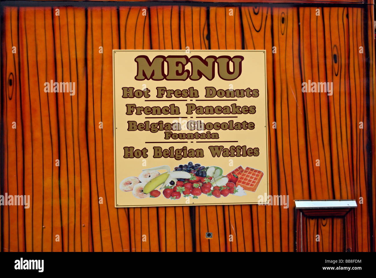 menu on british food vendors van offering donuts, belgian waffles and french pancakes Stock Photo