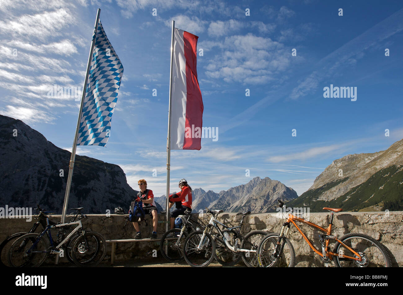 Mountainbike riders, male and female, taking a break at Karwendelhaus, alpine club house, Scharnitz, Tyrol, Austria, Europe Stock Photo
