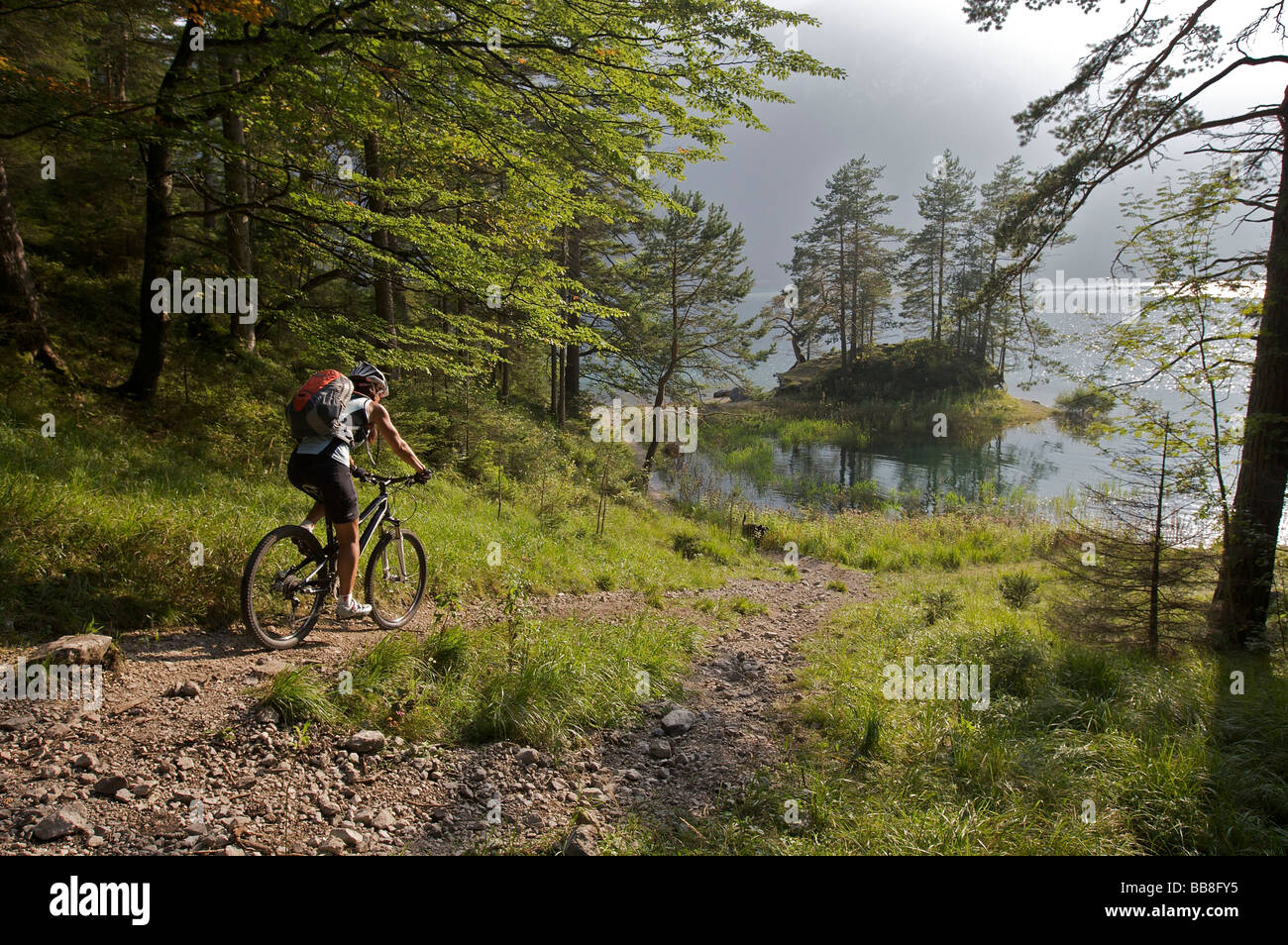 Female mountainbike rider at Eibsee Lake, Grainau, Upper Bavaria, Bavaria, Germany, Europe Stock Photo