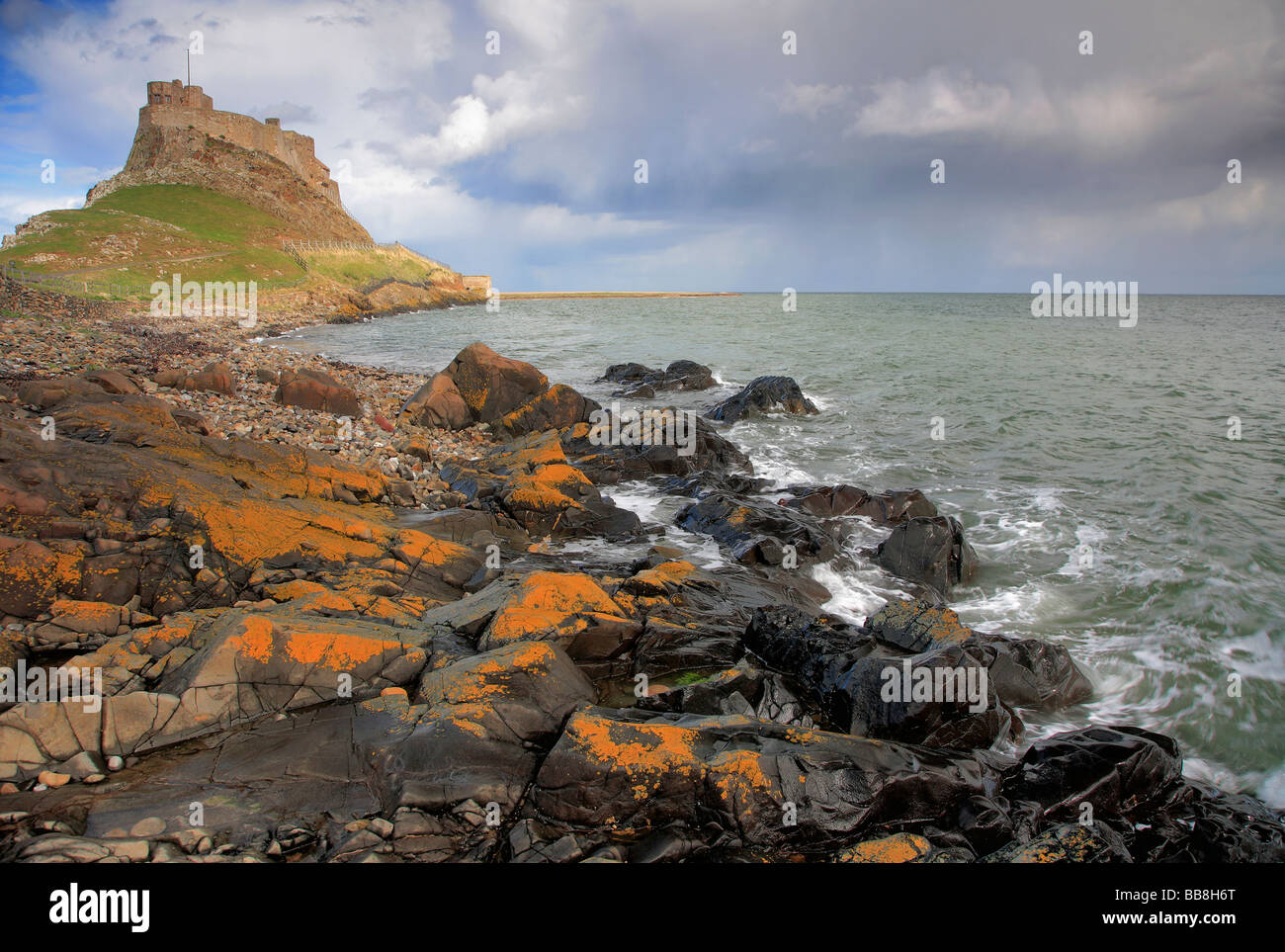 Storm Clouds Lindisfarne Castle Harbour Holy Island Lindisfarne North Northumberland Coast England UK Stock Photo