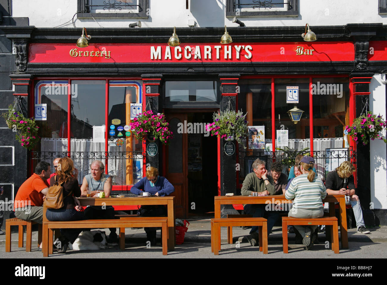 MacCarthy's, Irish pub, outdoor, people, Castletown, Cork, Ireland Stock Photo