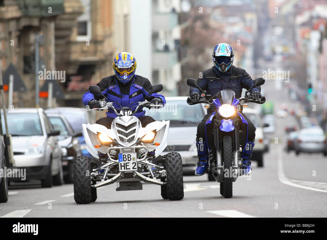 Quad and motorcycle, riding shot Stock Photo