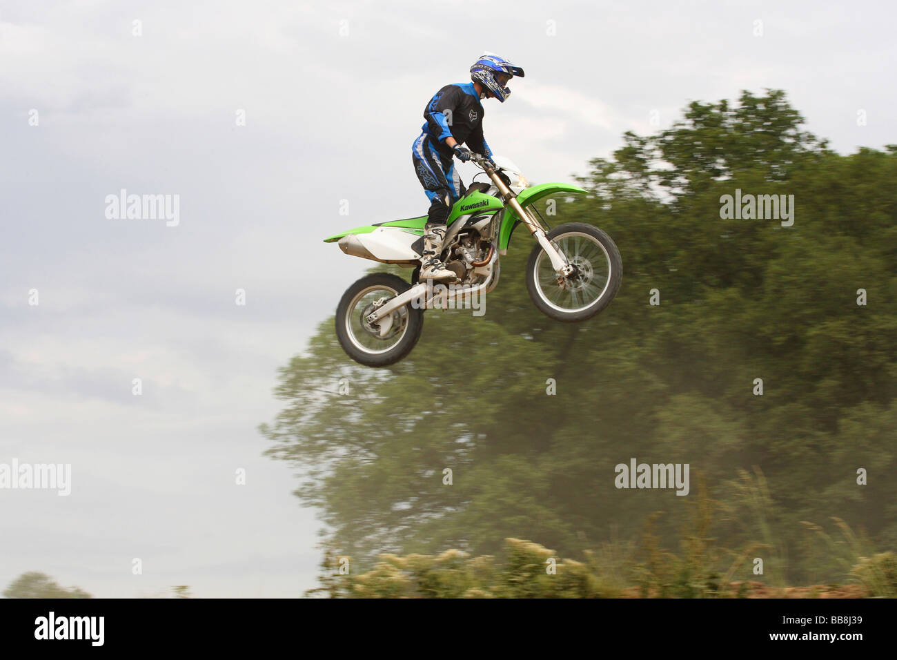 Jumping on a Kawasaki KLX 450R motorcycle Stock Photo