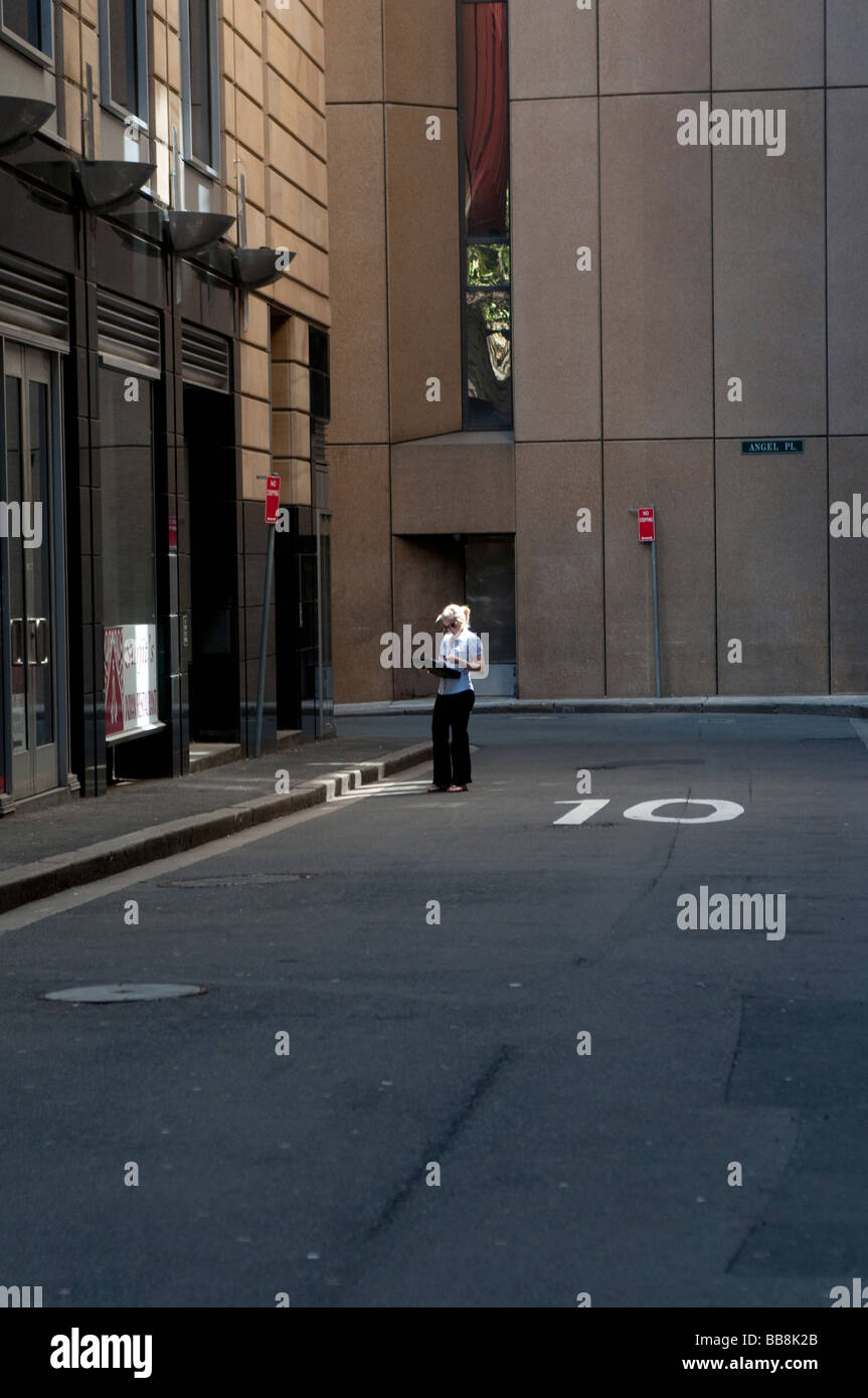 Woman with blond hair Angel Place Central Business District Sydney NSW Australia Stock Photo