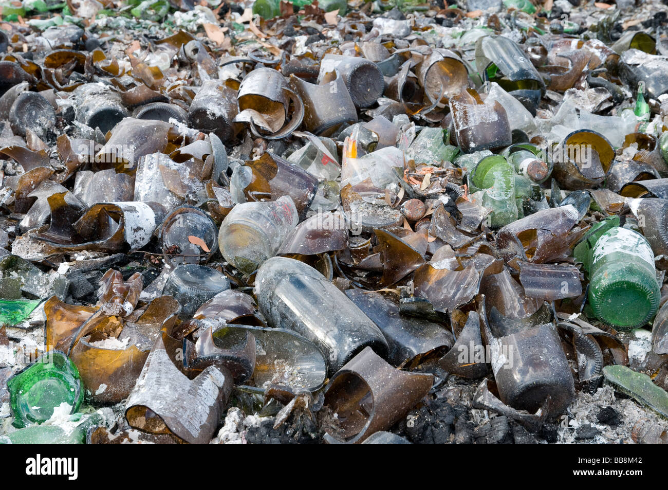 Remains of broken glass jars and bottles after a devastating bushfire