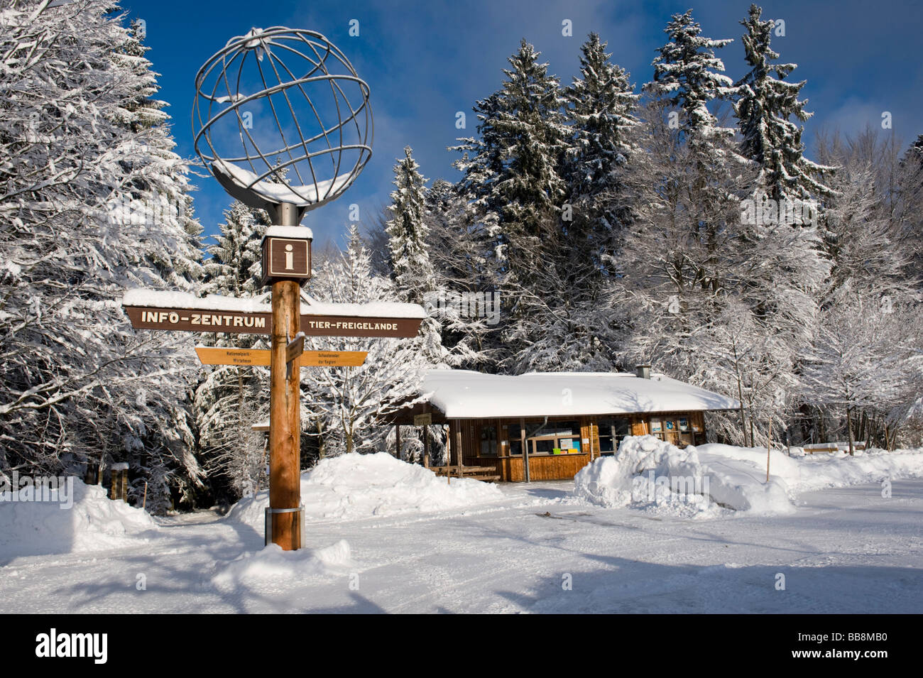 Signpost in the snow, globe, open-air enclosure, Bavarian Forest National Park, Bavaria, Germany, Europe Stock Photo