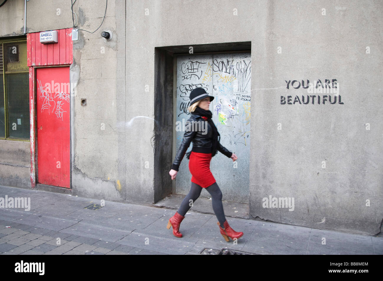 Trendy girl on Palace Street, lettering 'You are beautiful', Dublin, Ireland Stock Photo