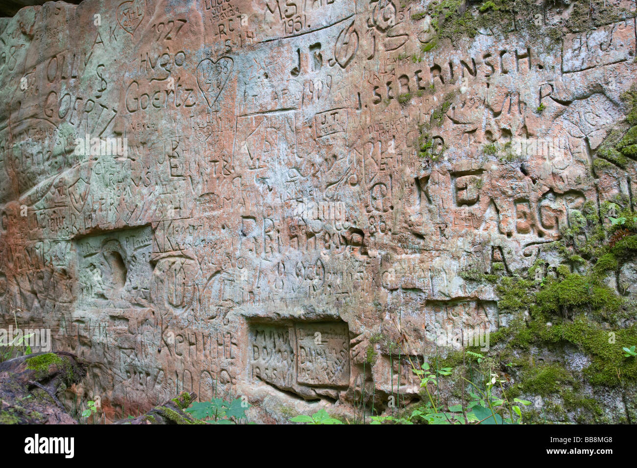 Inscriptions on the sandstone outcrop of Pikenes krauja, Pikene glen, Sigulda, Latvia, Baltic region Stock Photo