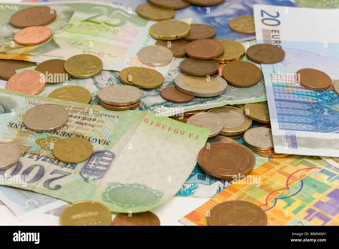 Assorted banknotes and coins Stock Photo