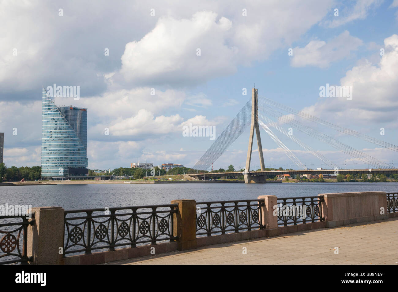 Cable bridge, Vansu tilts over Daugava and Saules Akmens building, Riga, Latvia Stock Photo