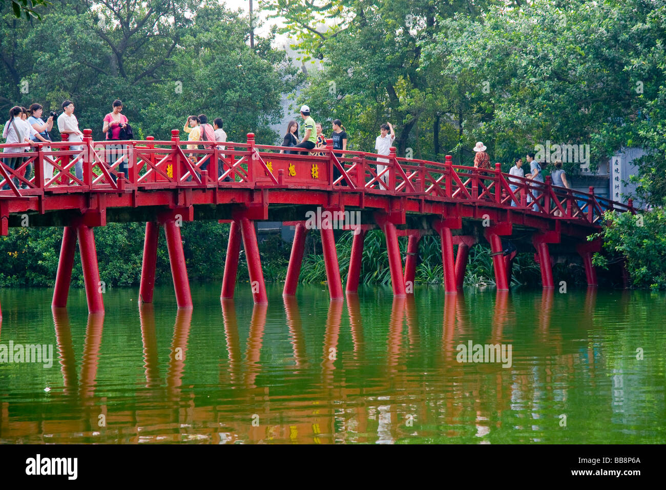 The Huc Bridge forms the crossing over Ho An Kiem Lake in the old quarter Hanoi, Vietnam Stock Photo