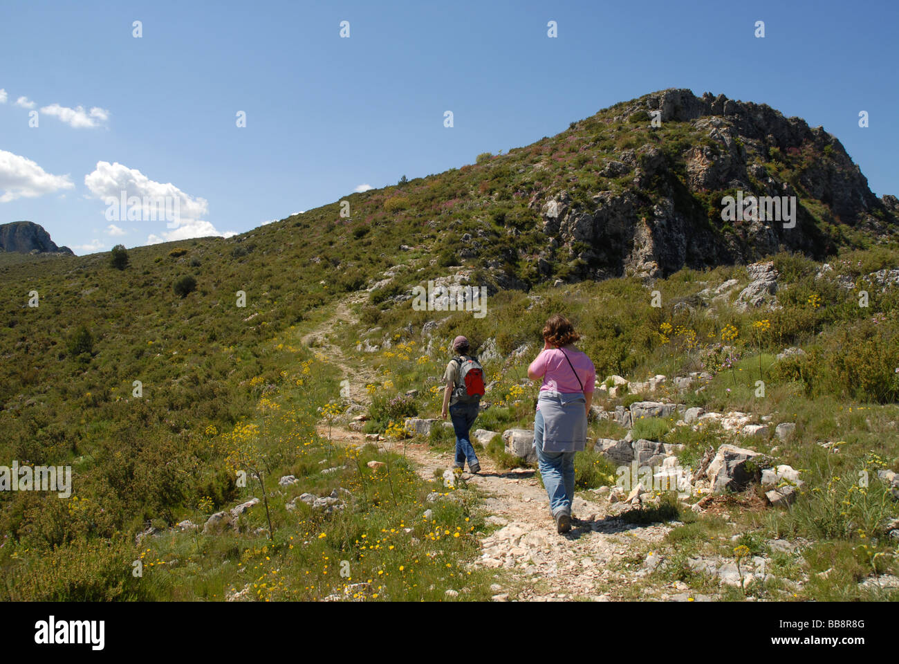 hiking to La Forada Rock Arch, Sierra de la Forada, Alicante Province, Comunidad Valenciana, Spain Stock Photo