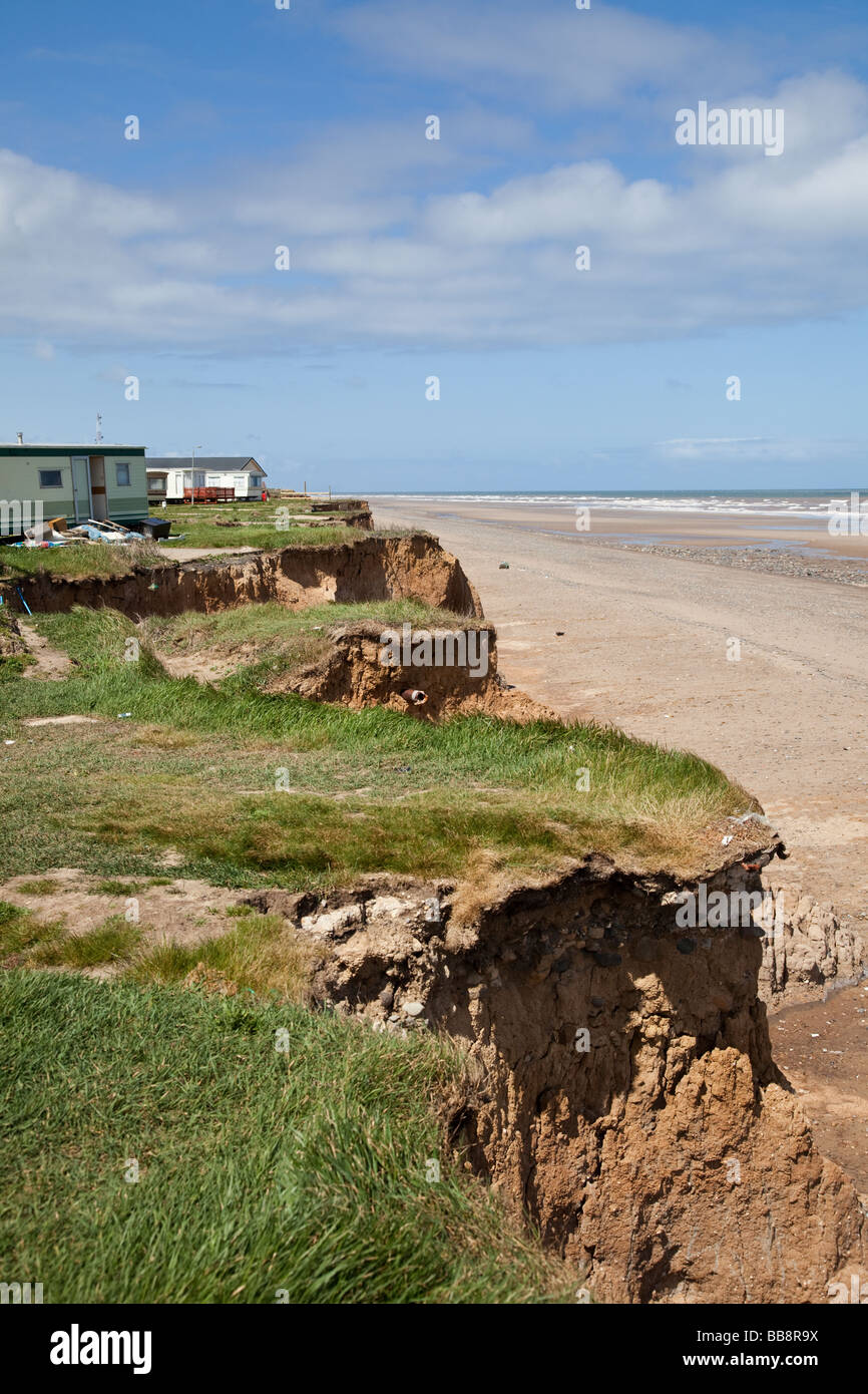 Holiday homes at a  caravan park in danger from North Sea coastal erosion on the cliffs of East Coast of England at Easington UK Stock Photo
