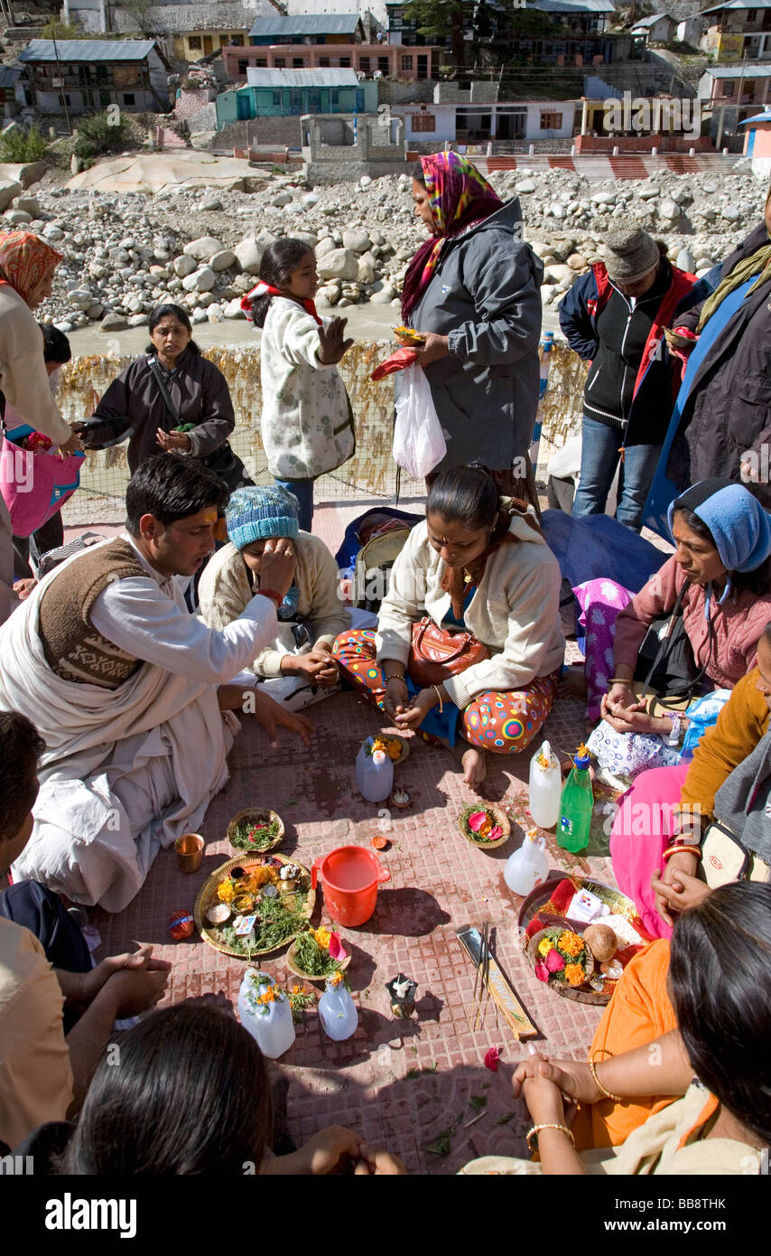 Hindu family making a puja ritual. Gangotri. Uttarakhand. India Stock ...