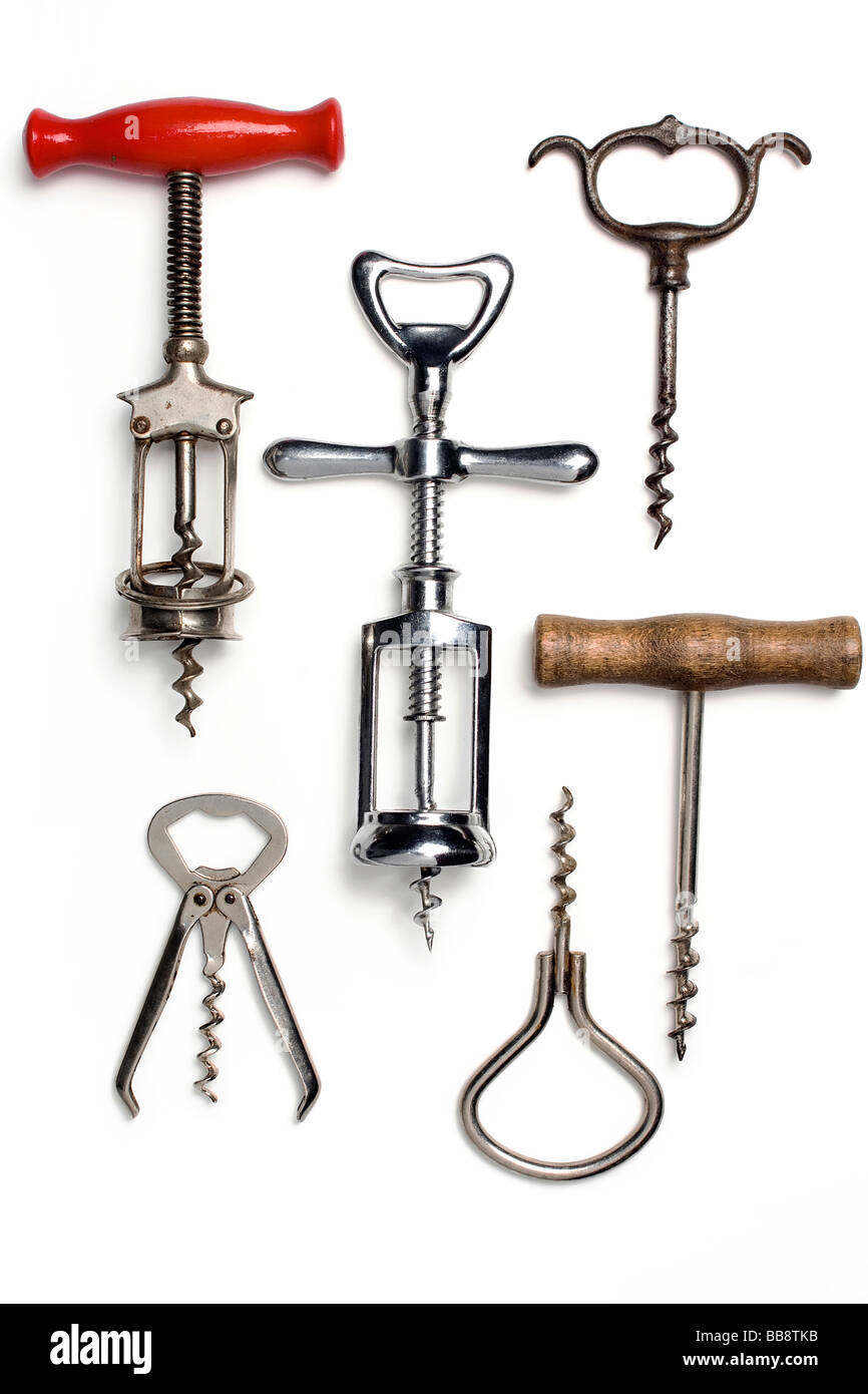 a collection of old corkscrews on white Stock Photo