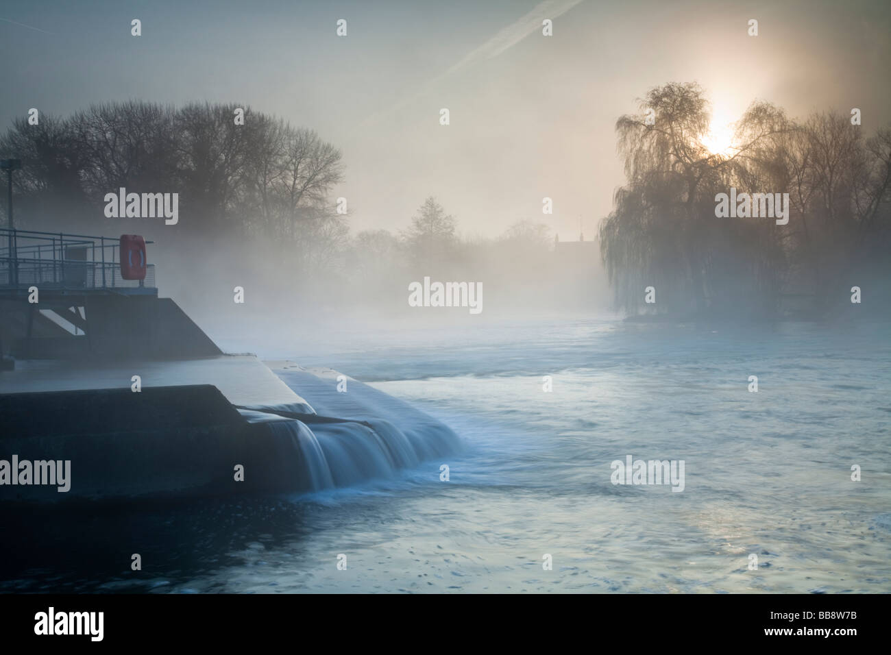 Pangbourne weir on the River Thames on a misty dawn Berkshire Uk Stock Photo