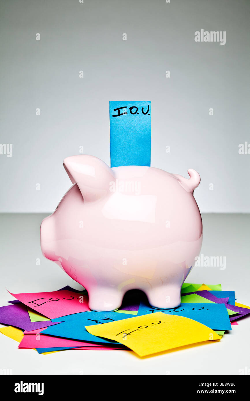 Piggy bank with IOU Stock Photo