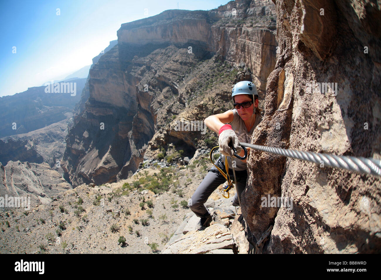 Climbing “Oman's Grand Canyon” via the Ferrata route to the top-plateau of Jebel Shams in Oman Stock Photo