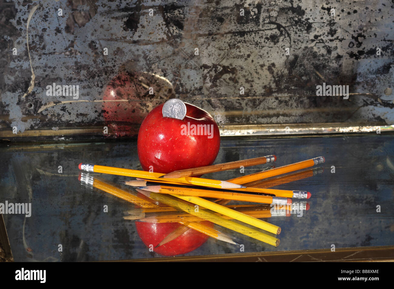 Recession,,nickles and dimes, apples and pencils Stock Photo