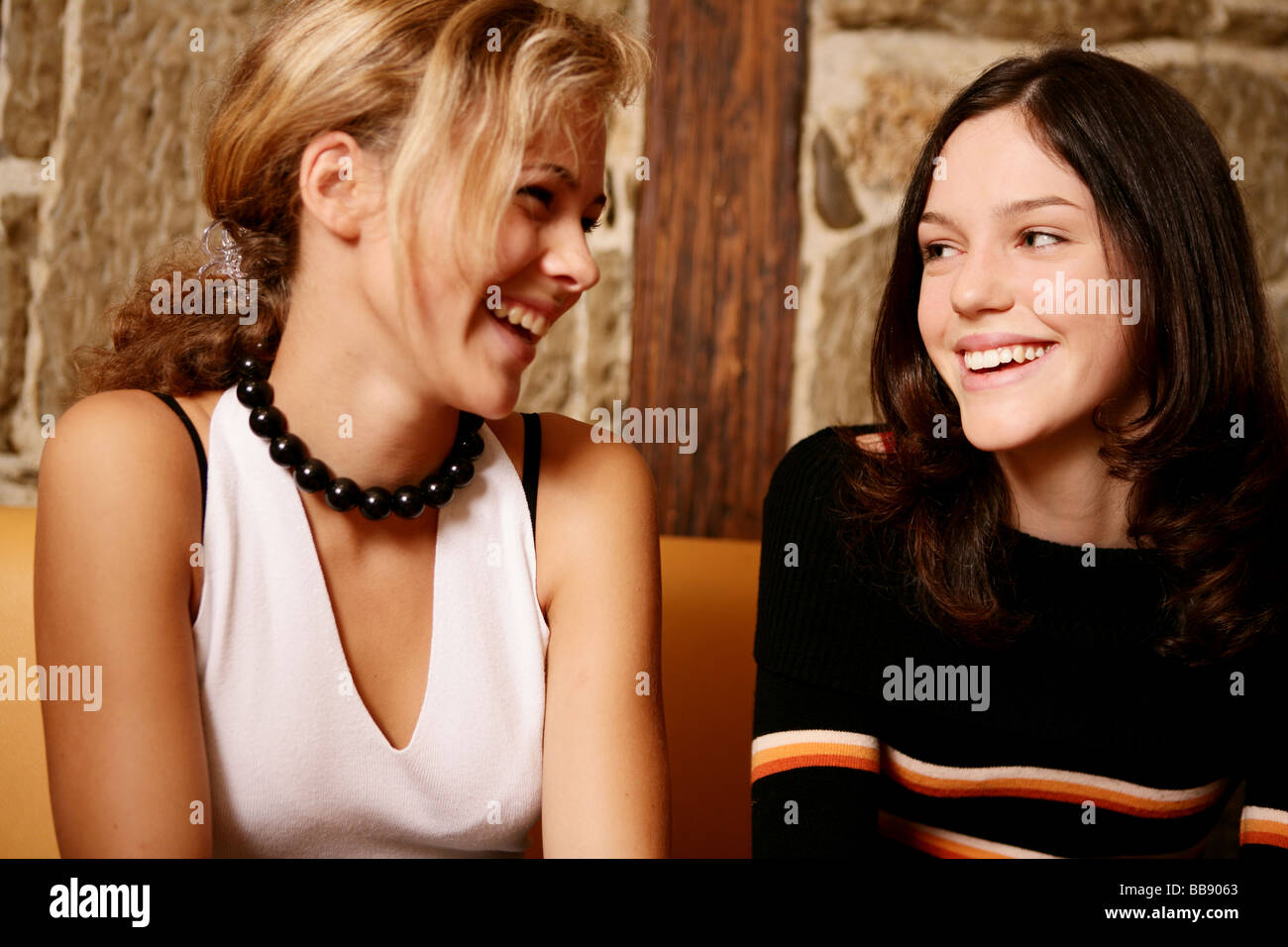 Portrait of teenager girls laughing in a restaurant Stock Photo