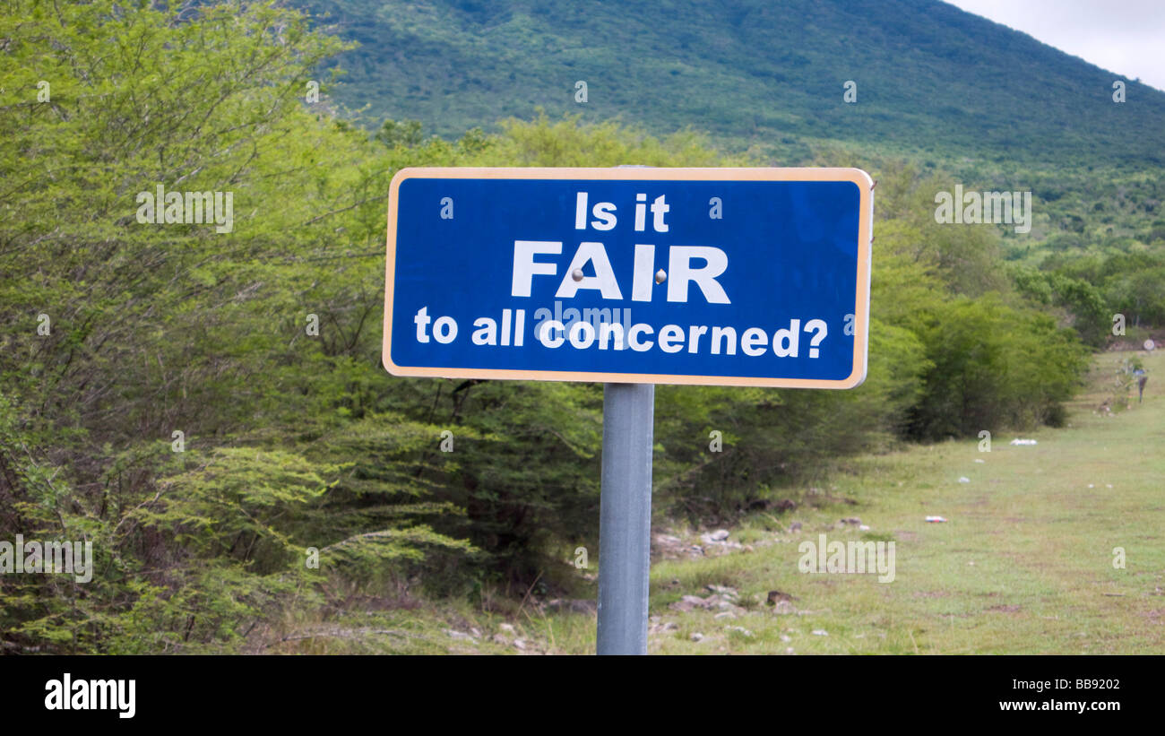 Epithets sayings and advice are posted as road signs on Nevis in the Caribbean Stock Photo