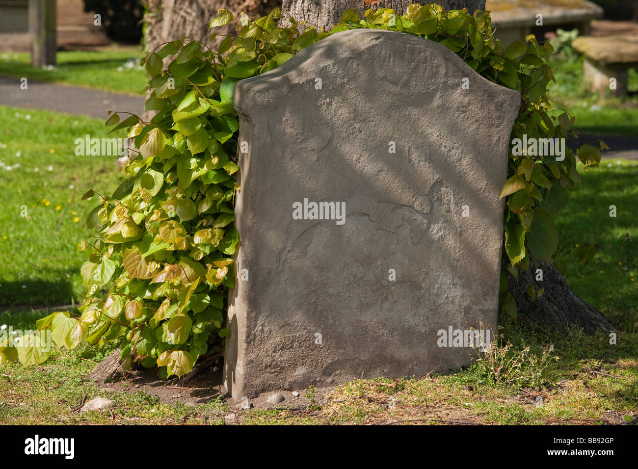 Old gravestone with no name details eroded and lost Stock Photo