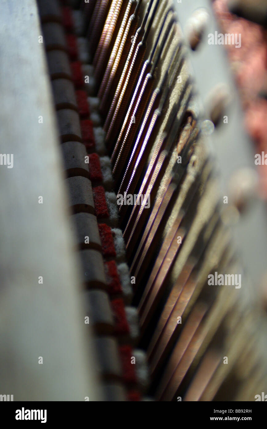 upright piano inside workings strings tension Stock Photo Alamy