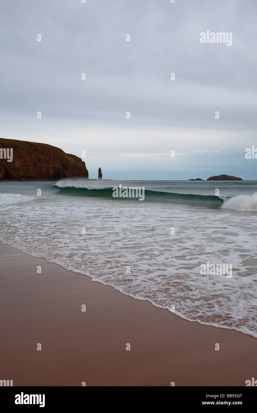 wave breaks on shore of beach at Sandwood Bay Britain's most remote beach Sutherland Northern Scotland Great Britain UK Stock Photo