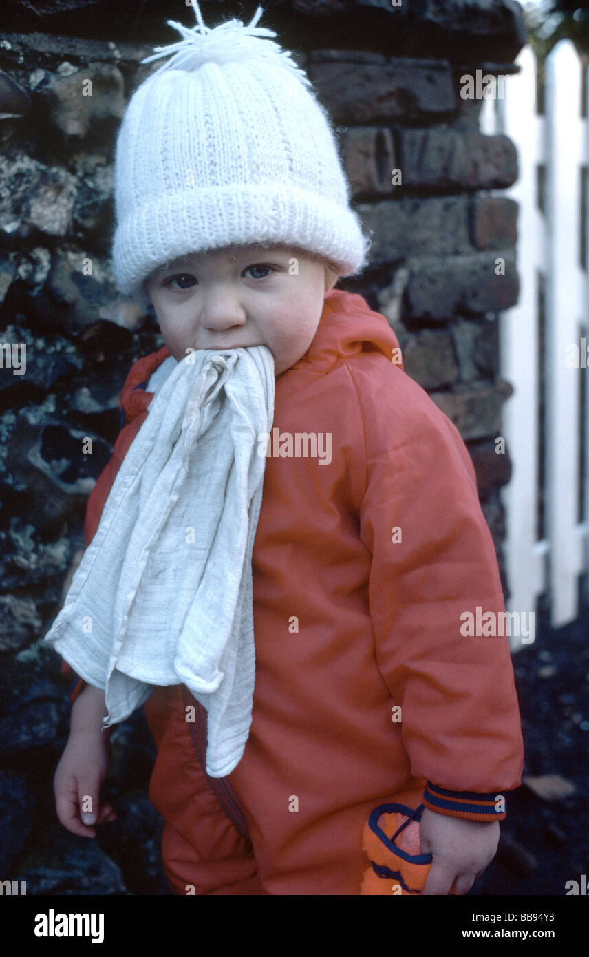 young child carrying a comfort blanket in her mouth Stock Photo Alamy