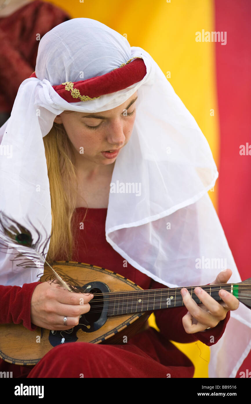 A reenactor playing a lute at a medieval reeactment, Tewkesbury, UK Stock Photo