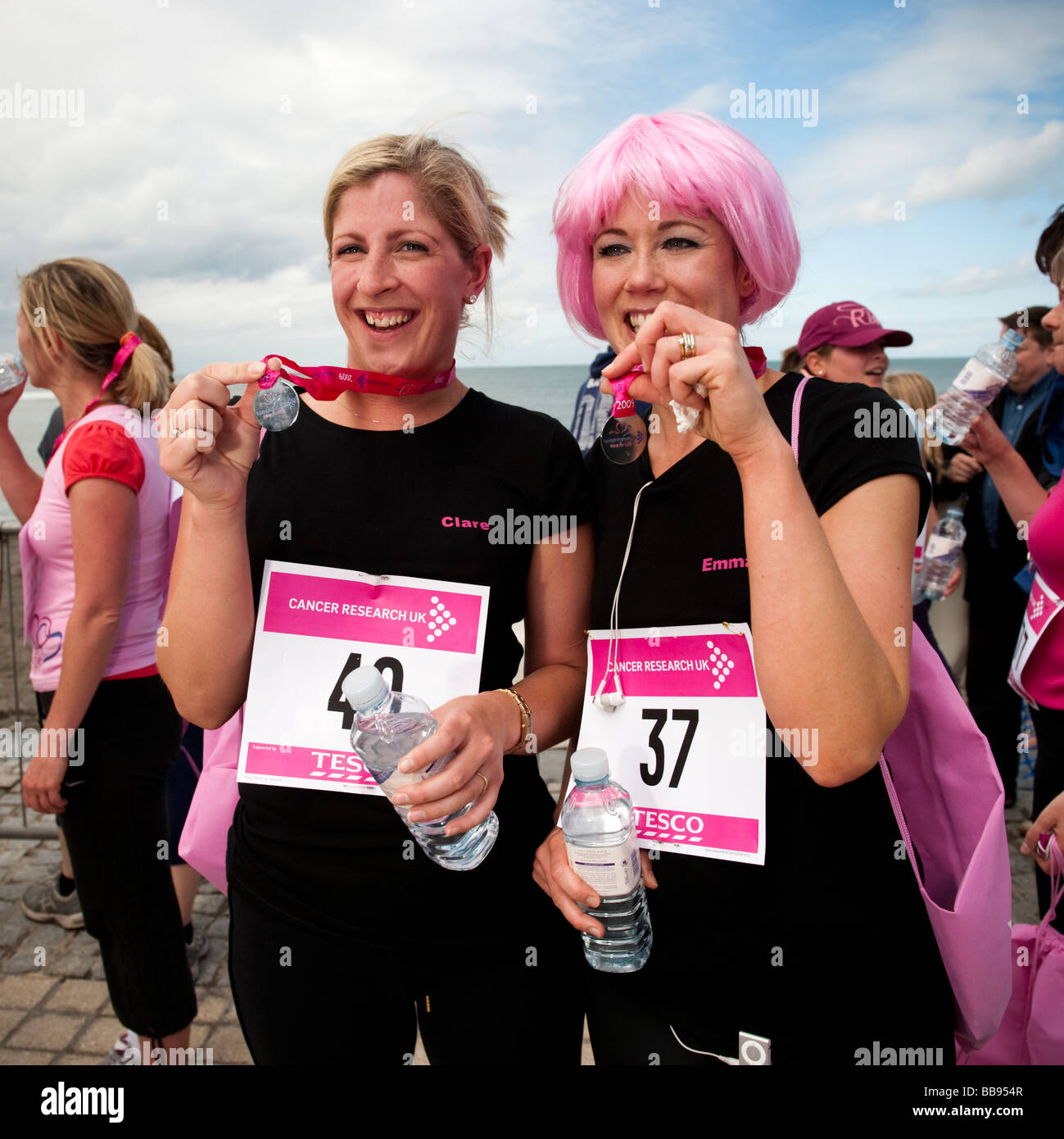 two Women competing in the Race For Life sponsored run to raise money for cancer research Aberystwyth Wales UK May 2009 Stock Photo