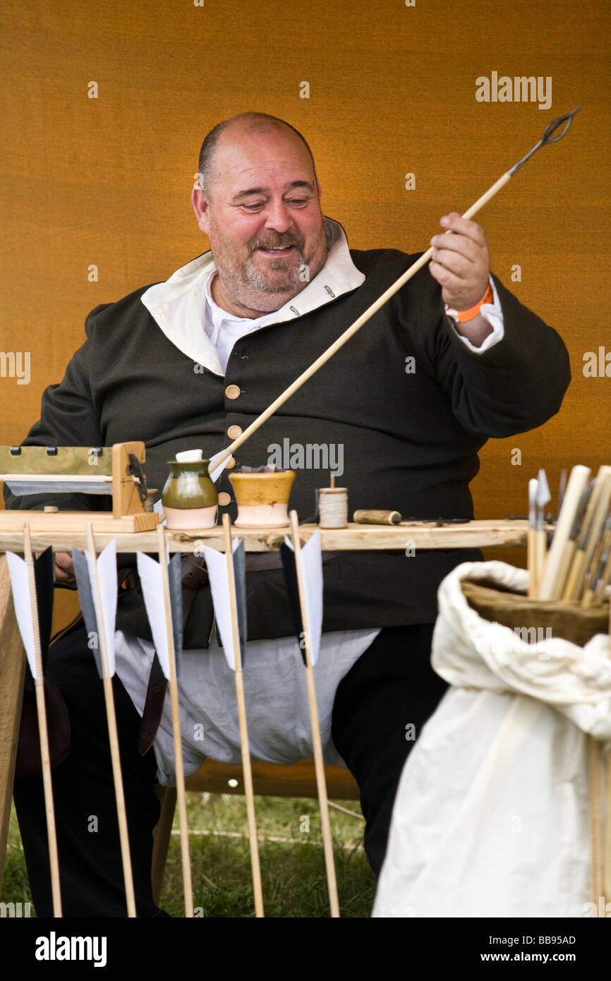 Reenactor dressed as a Fletcher or Arrow-maker at Tewkesbury Medieval Festival, Gloucestershire, UK Stock Photo