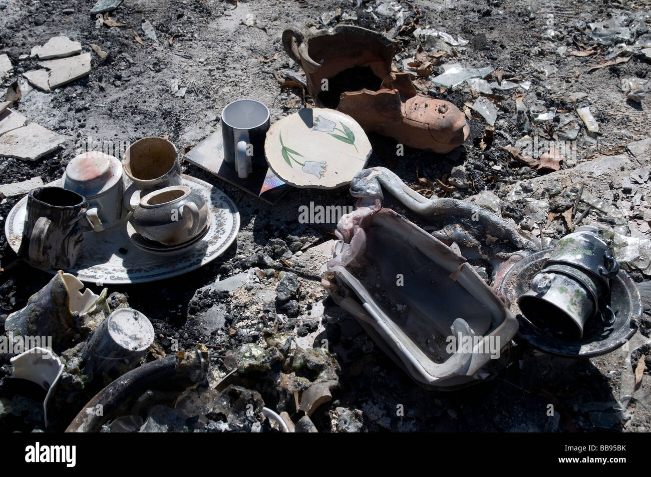 Remains of household objects after a devastating bushfire Stock Photo