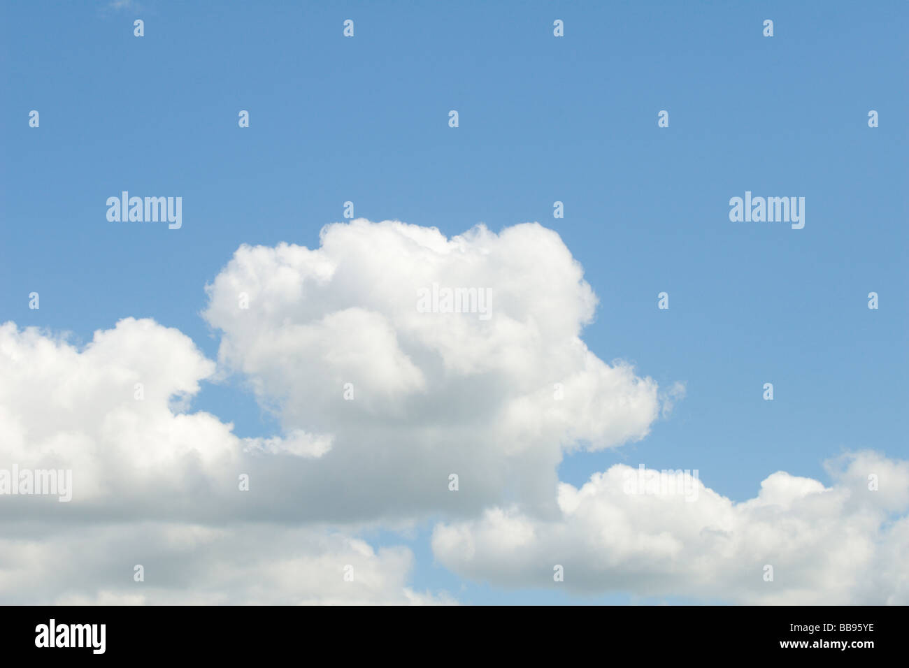 Fluffy clouds on a blue sky Stock Photo - Alamy