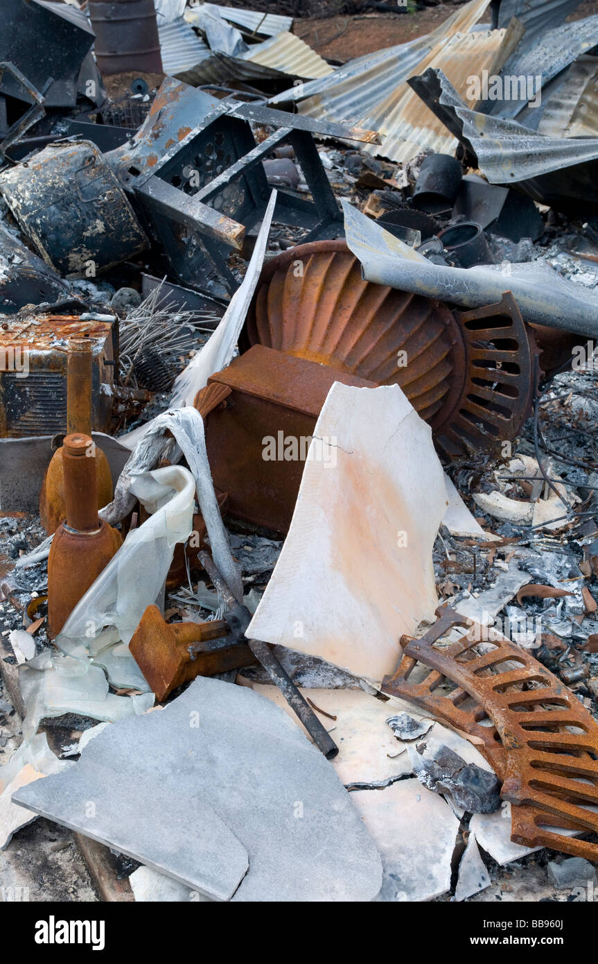 Remains of household objects after a devastating bushfire Stock Photo