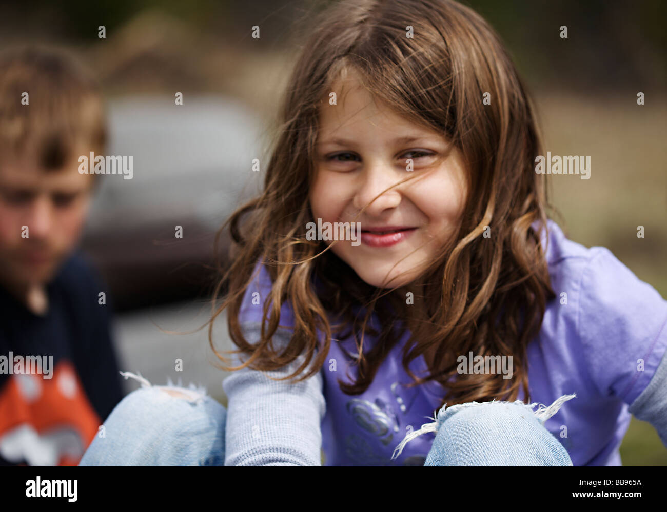 Portrait of a happy young girl at the playground Stock Photo - Alamy
