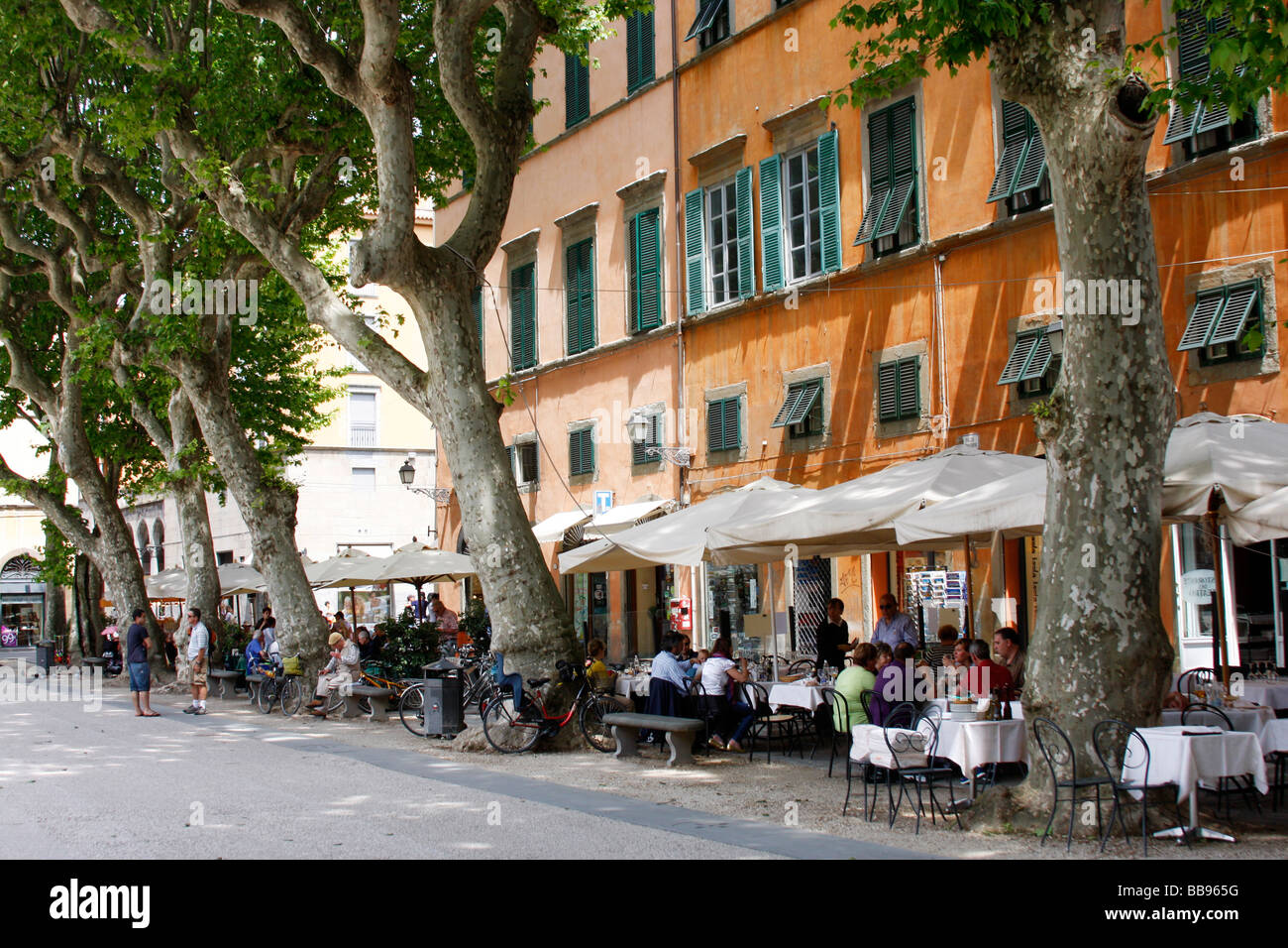 Popular restaurant and picnic piazza in the market town of LUCCA  an Etruscan town originally established by the Romans in 180BC Stock Photo