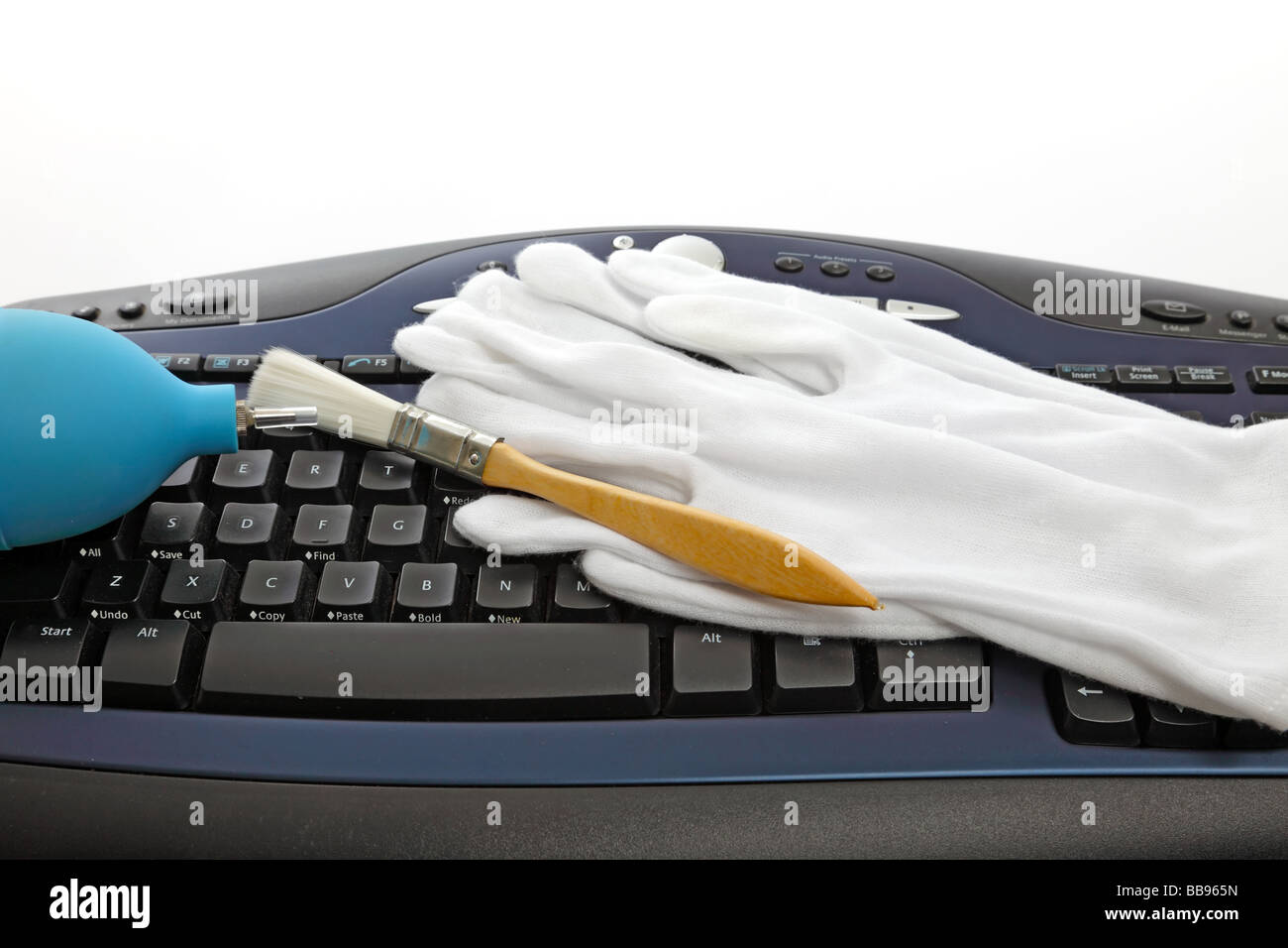 Cleaning a black modern computer keyboard Stock Photo - Alamy